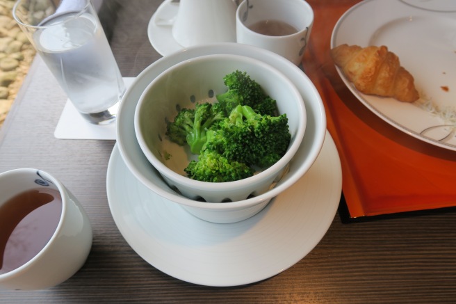 a bowl of broccoli on a plate