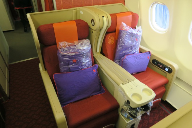 a seat with pillows on the side