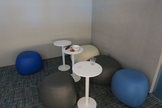 a group of round tables and round blue and white balls