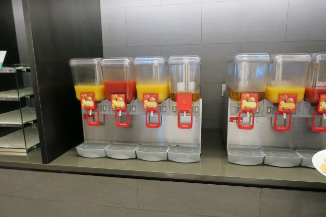 a group of juice dispensers