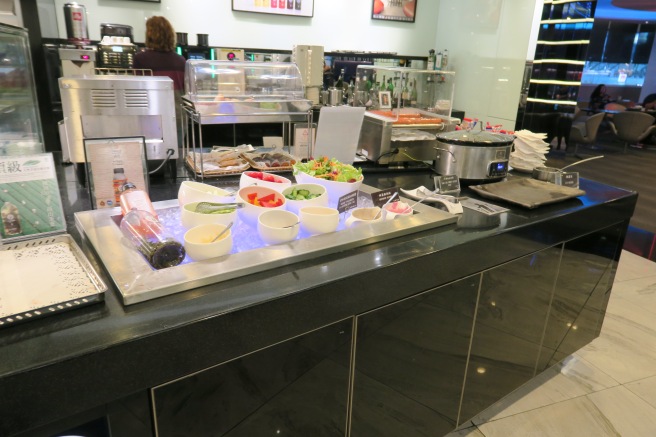 a buffet counter with different food items