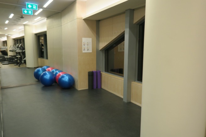 a group of exercise balls in a room