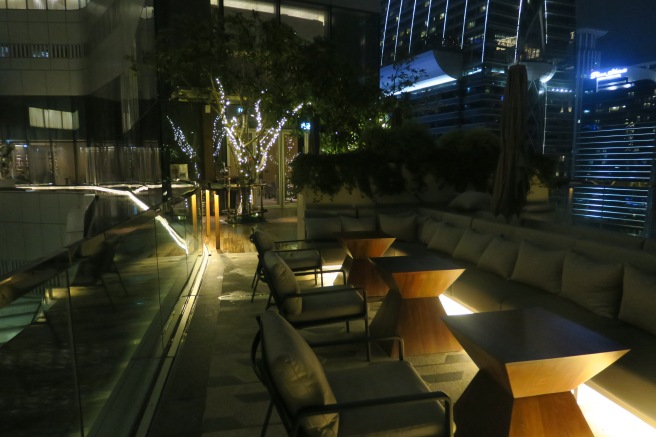 a table and chairs outside at night