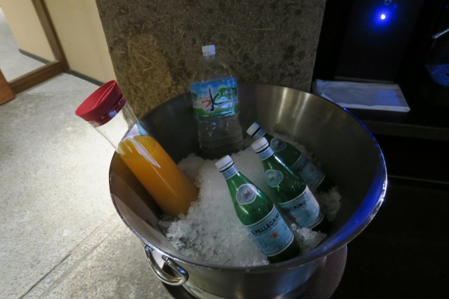 a bucket of ice and bottles of soda