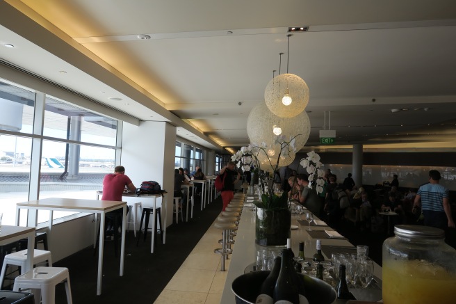 a long table with white chairs and white tables and white chairs