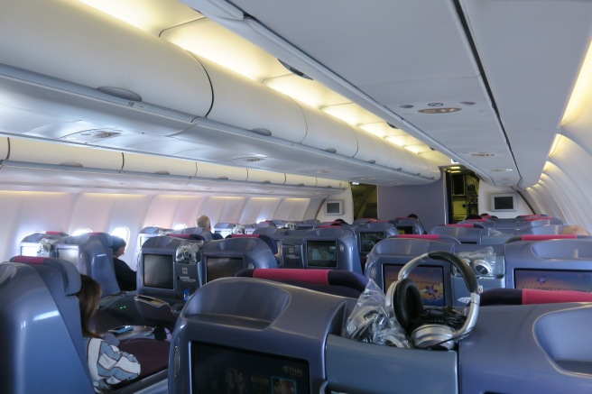 a plane with seats and monitors