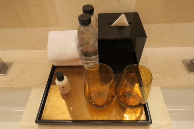 a tray with a couple of glasses and a tissue box