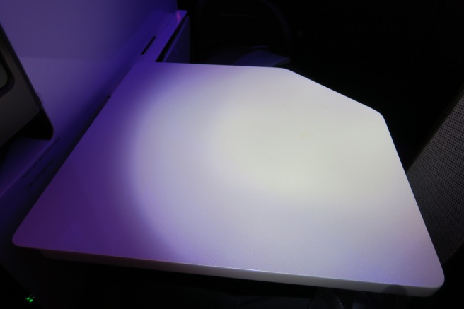 a white object with a purple light
