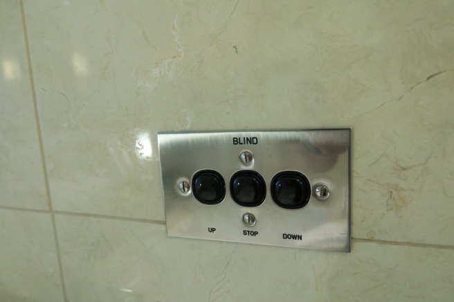 a metal plate with black buttons on it