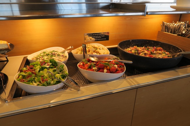 a buffet line of salads