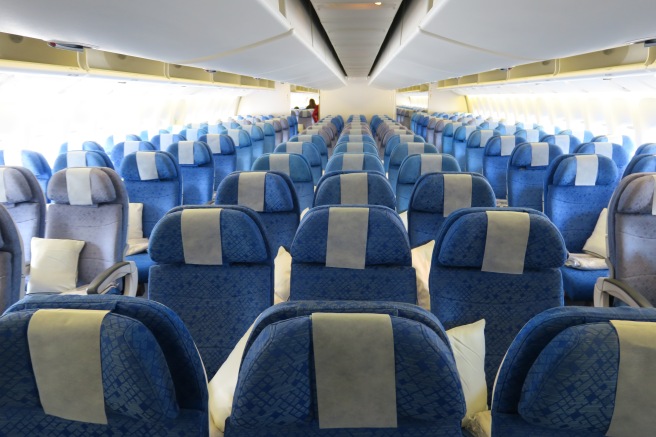 a row of blue and white seats