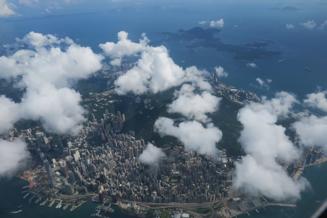 aerial view of a city with clouds above