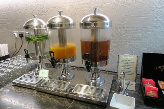 a group of beverage dispensers on a counter