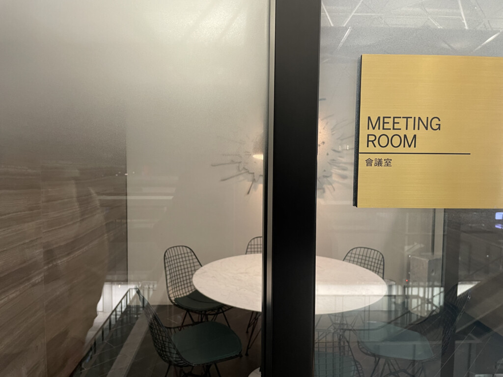 a meeting room with a table and chairs