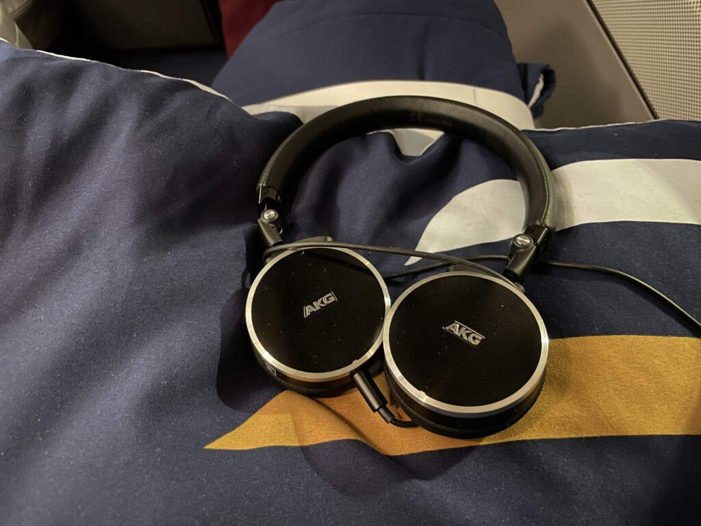 a pair of headphones on a bed