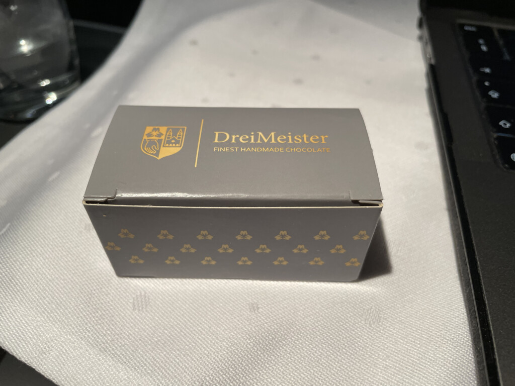 a small box with gold text on it
