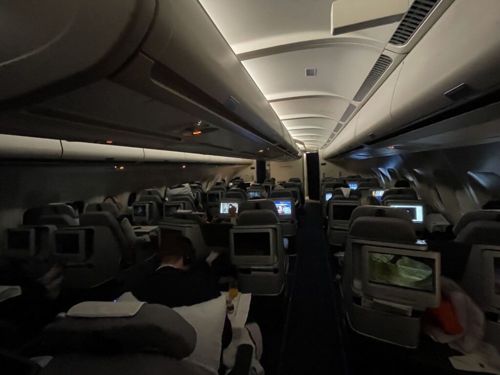 an airplane with many seats and a few monitors