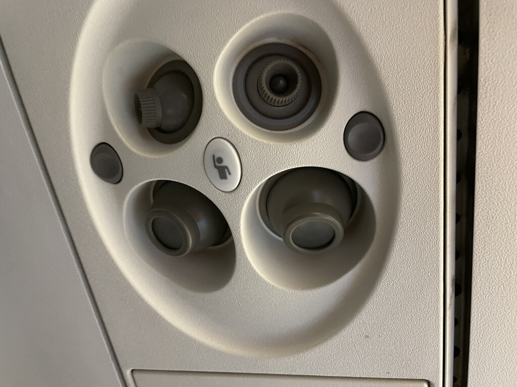 a close up of a seat and a seat button