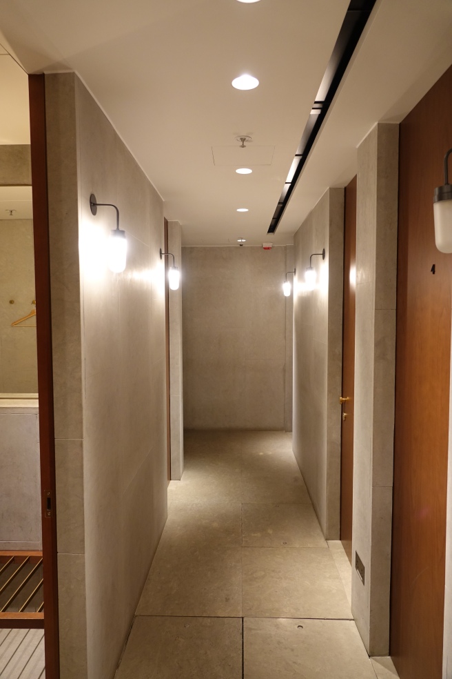 a hallway with light fixtures