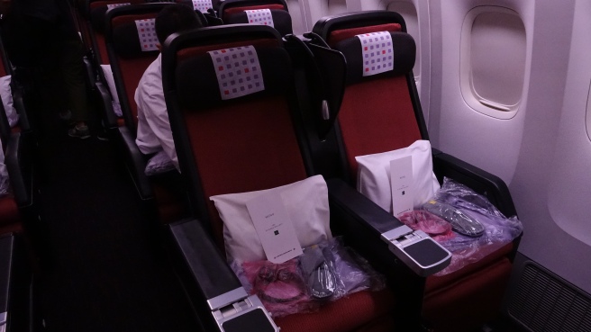 a row of seats with a person sitting in it