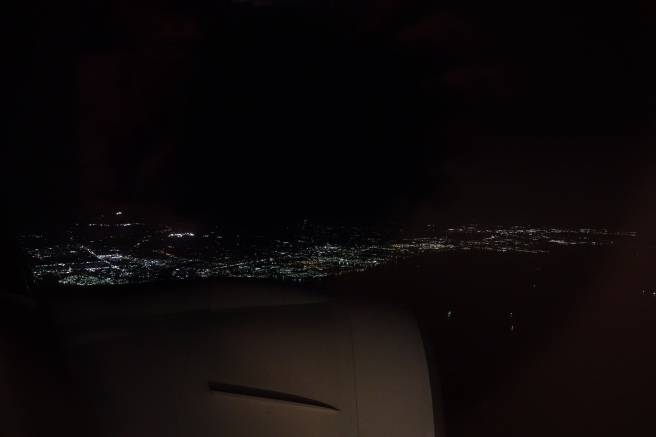a city at night from an airplane