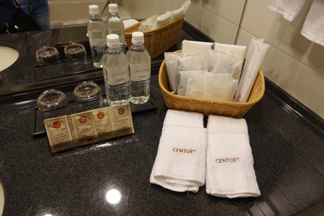 a group of towels and bottles of water