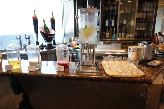 a bar with glasses and drinks