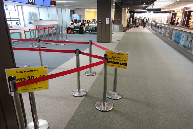 a line of red tape with a yellow sign