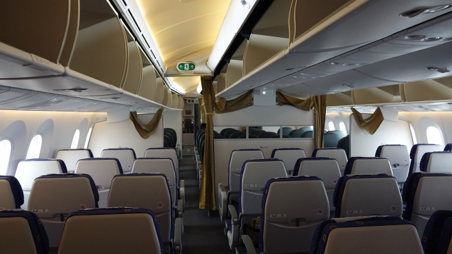 an airplane with seats and a shelf