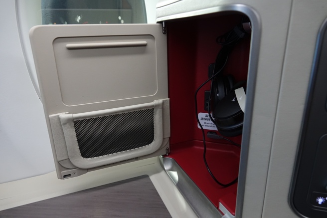 a door with a speaker and headphones inside