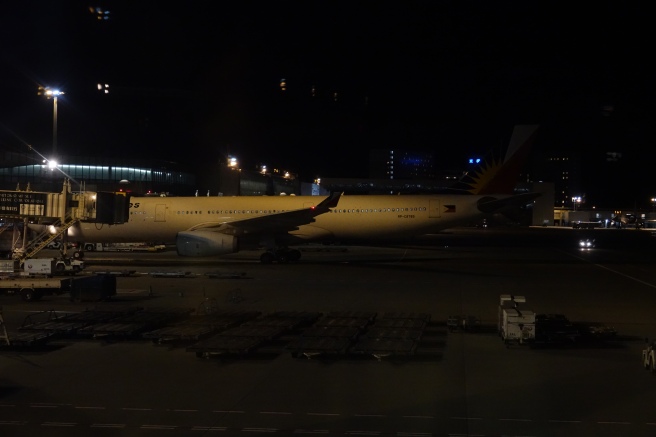 an airplane on the runway at night