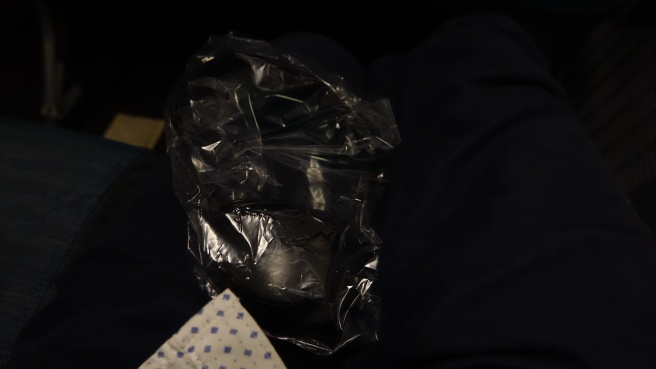 a plastic bag on a person's lap