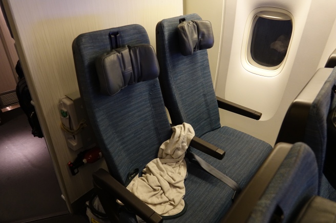 a seat with a blanket on it