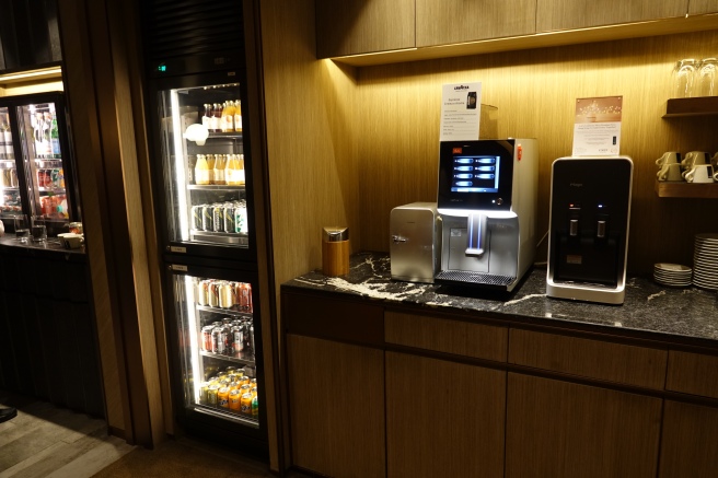 a machine and beverage cooler in a room
