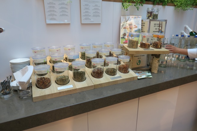 a counter with containers of herbs and spices