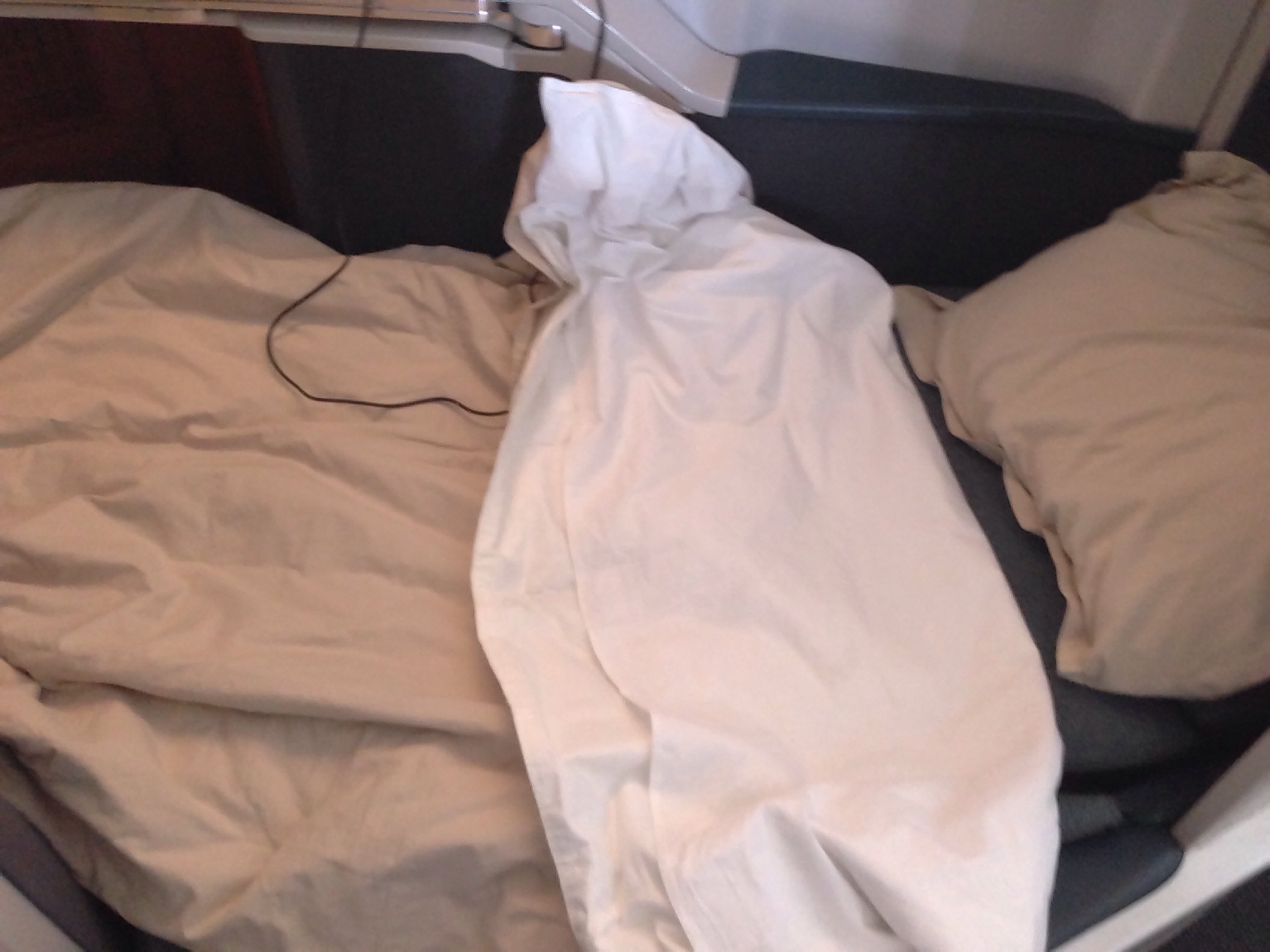 a white sheet on a bed