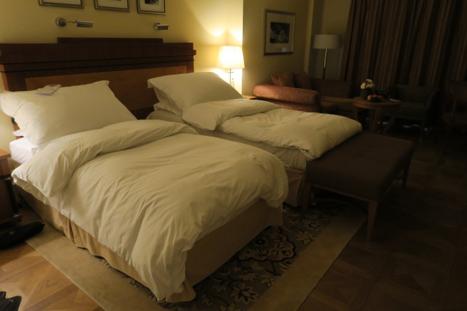 a hotel room with two beds
