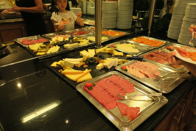 a girl eating food in a buffet