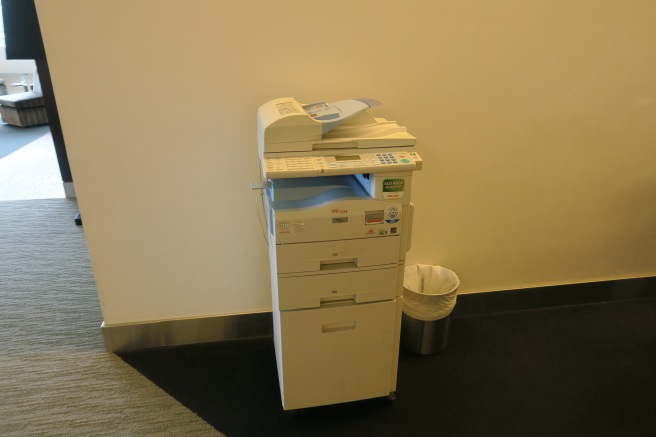 a multifunctional printer in a room