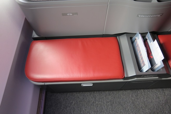 a seat with a red cushion