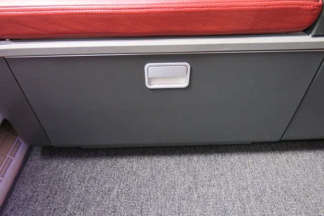 a grey box with a red seat