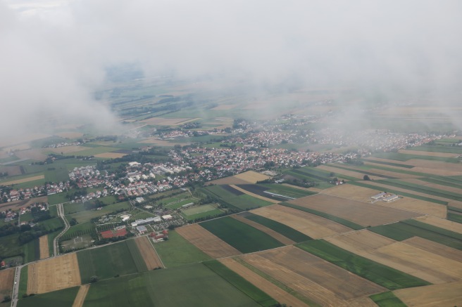 aerial view of a city and fields