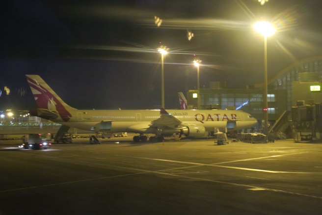 an airplane on the tarmac at night
