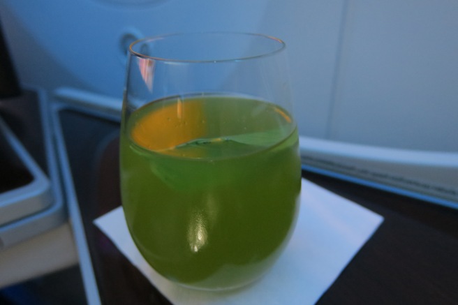 a glass of green liquid