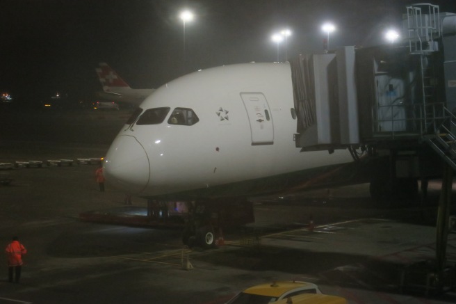 a white airplane at night