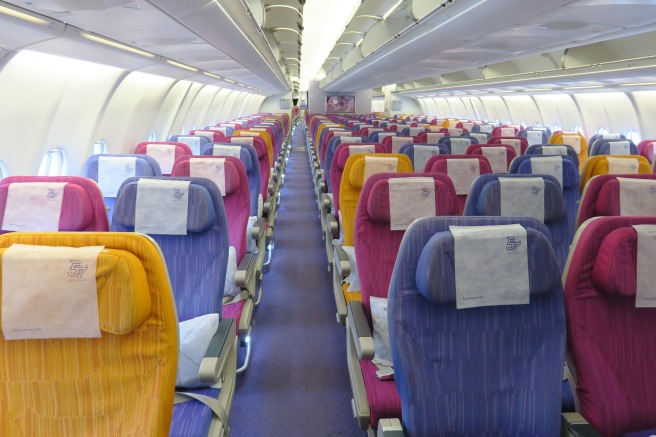 rows of colorful seats on an airplane