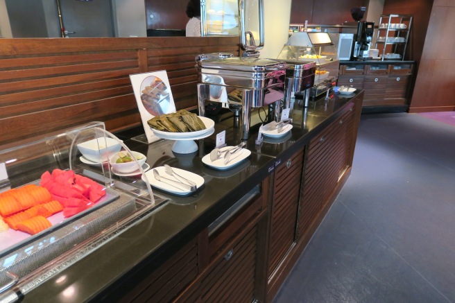 a buffet table with food items on it