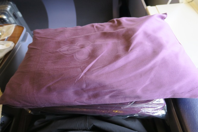 a purple blanket in a plastic bag