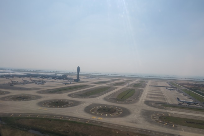 an airport with many round roads and a tower
