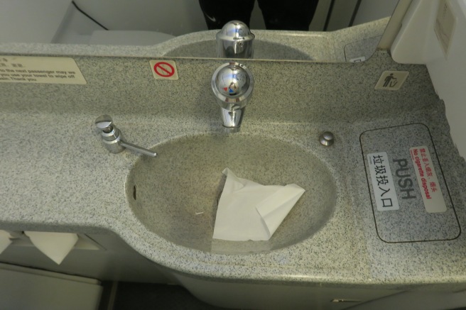 a sink with a napkin in it